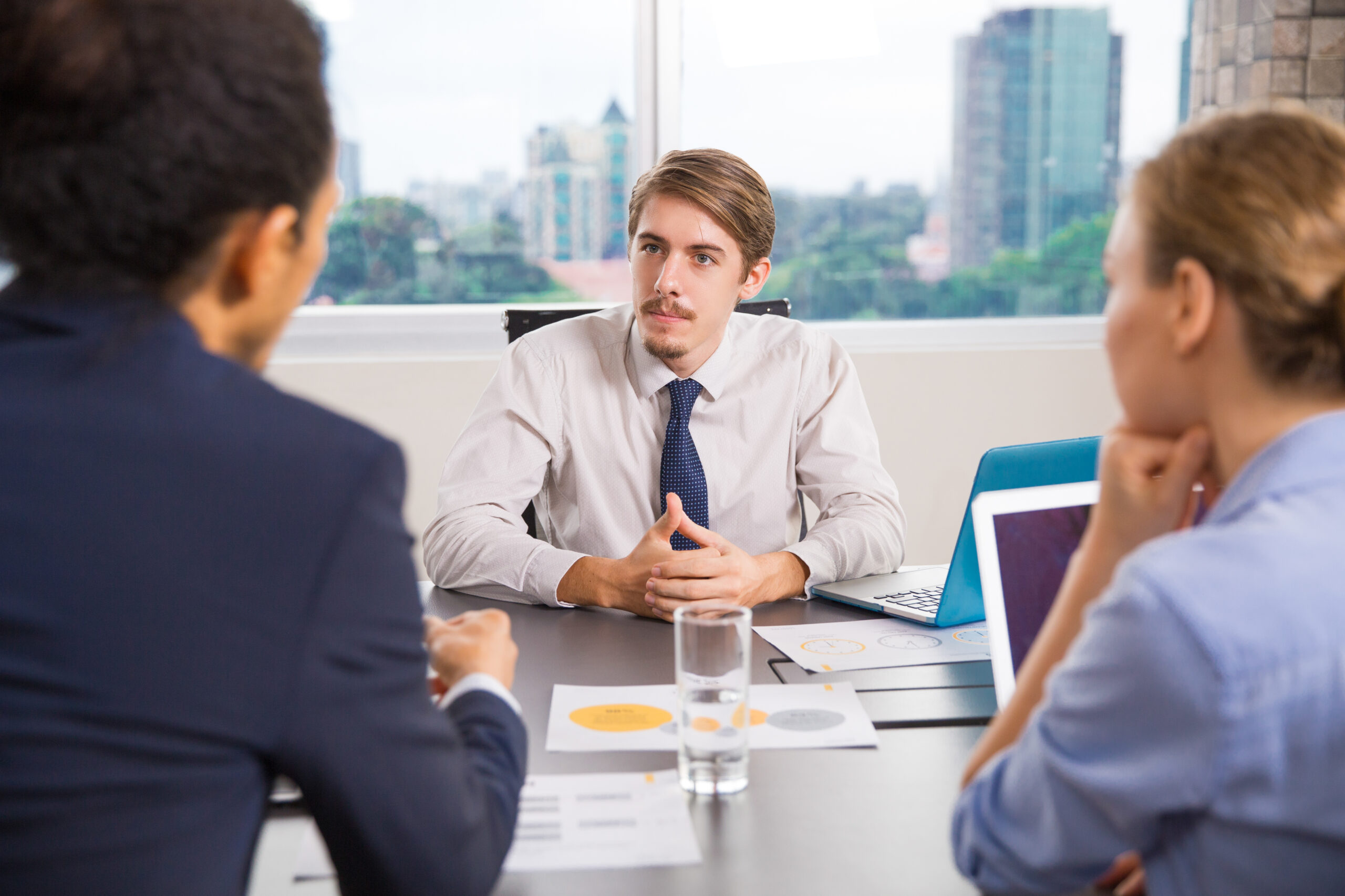Business professionals discussing financial dispute